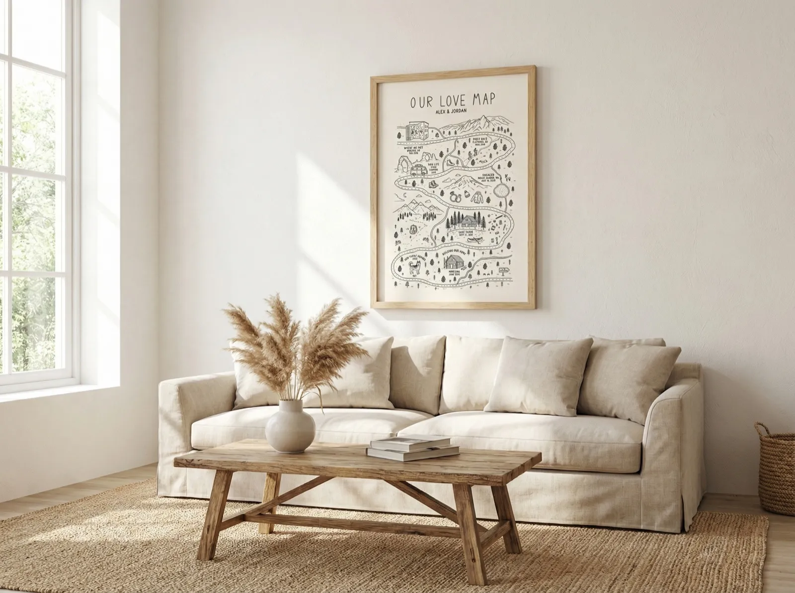 A custom love map in a light wood frame on a white wall beside a large window, above a cream sofa with a jute rug and a rustic wooden coffee table.